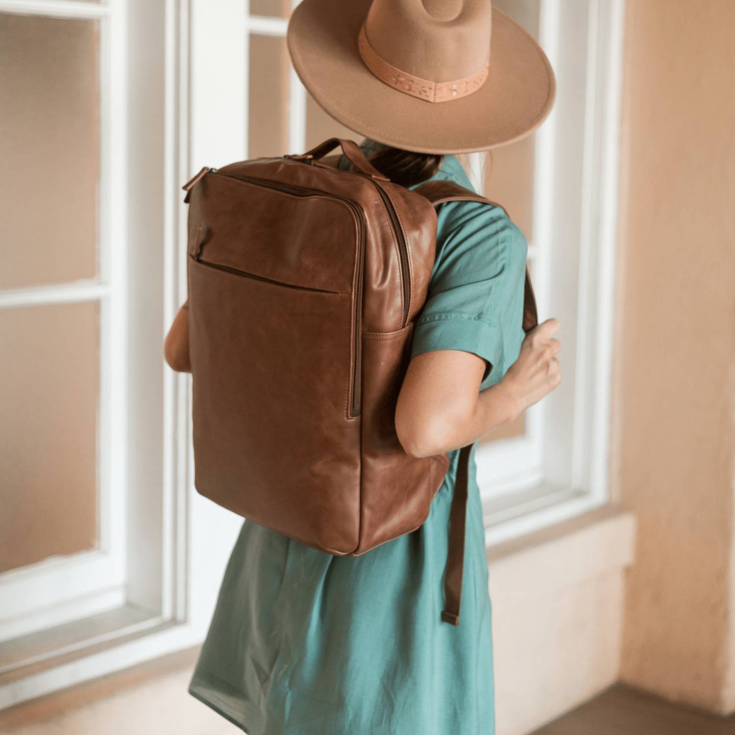 black leather backpack vs brown leather backpack Italian Full Grain for Men a zippered back sleeve to affix the bag to carry Are Leather Bags Too Heavy